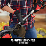 Photo of Craftsman grass trimmer with adjustable pole, red handle, CMCBL700D1, being held outdoors.