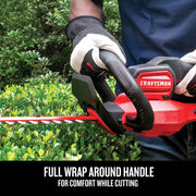 Photo of CRAFTSMAN hedge trimmer CMCHTS820B with wrap around handle, used cutting bushes outdoors.