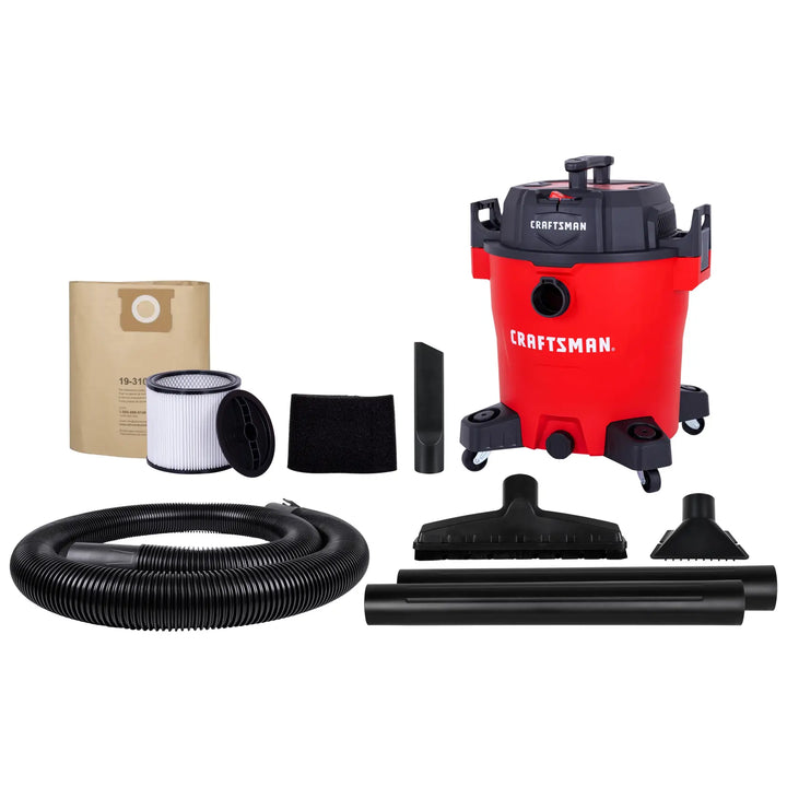 A CRAFTSMAN red and black wet/dry vacuum with wheels, shown with its accessories including a hose, two extension wands, a filter, a dust bag, a foam filter, a crevice tool, a wide floor nozzle, and a smaller nozzle. All items are displayed on a white background.