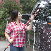 Photo of Craftsman car wash brush in use on a truck, SKU CMXMLBA7210A, outdoor setting.